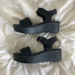 Black a new day platform sandals.